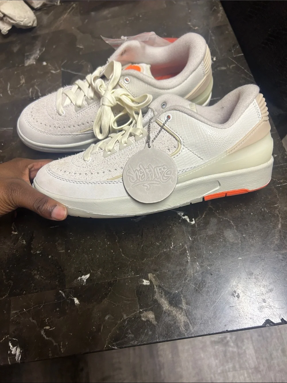 Jordan Low-Top Sneakers in Light Gray with Orange Accents